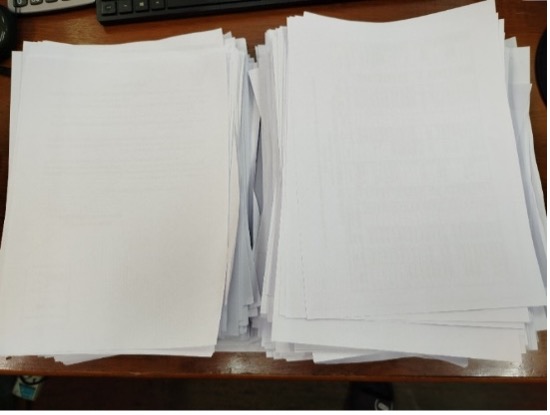 (b) Sorted one-sided printed paper for reusing